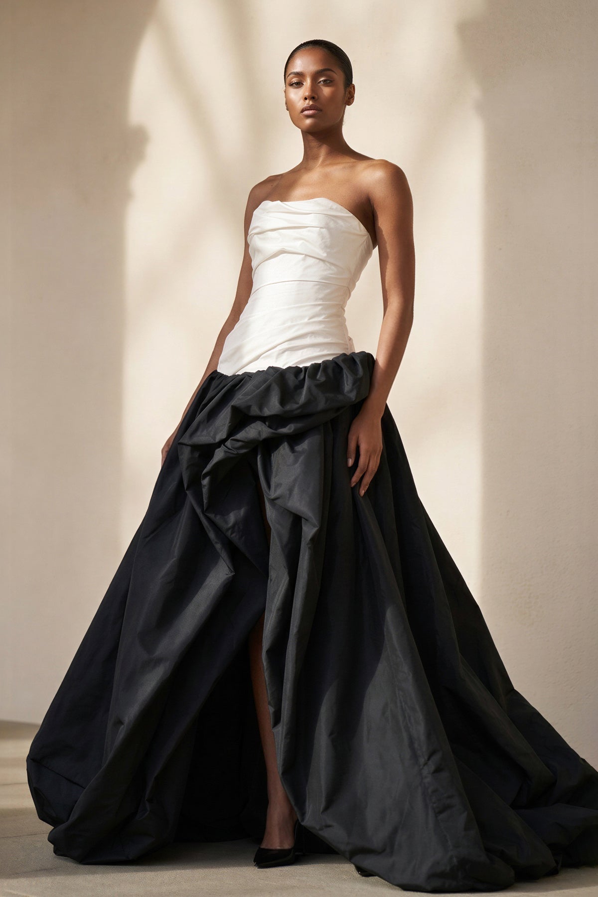 Pleated Strapless Gown With Slit in Black and Ivory