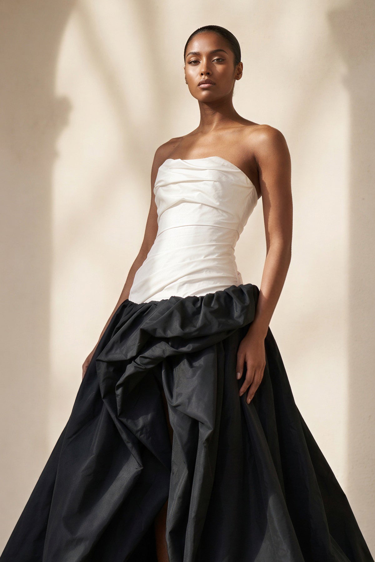 Pleated Strapless Gown With Slit in Black and Ivory